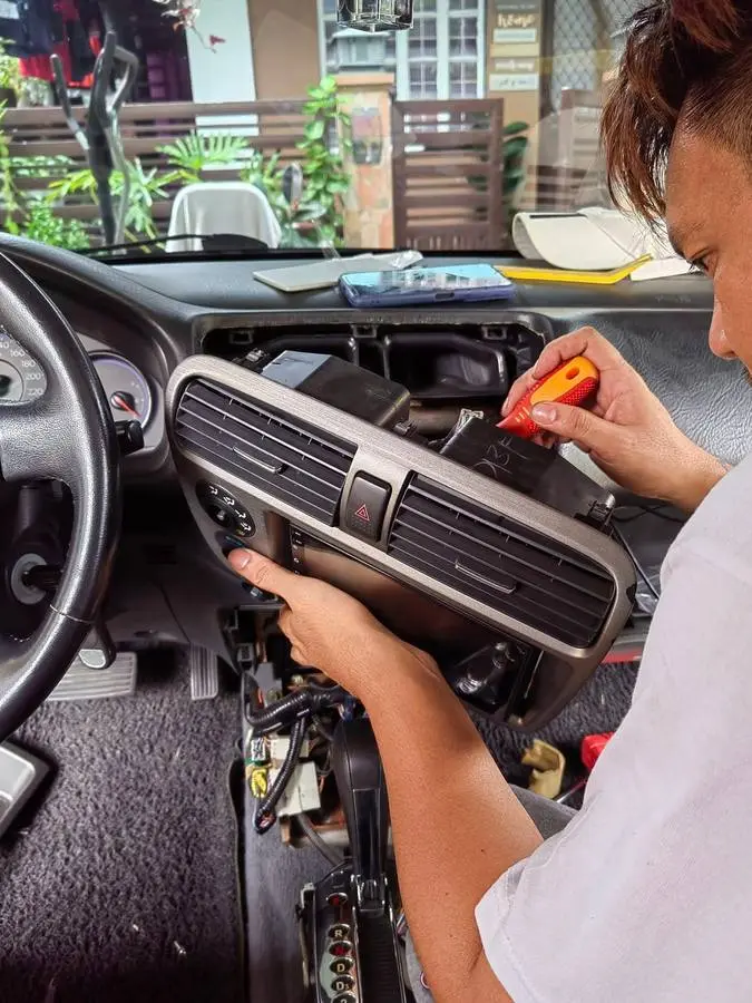 Audiograph installer working inside a customer vehicle